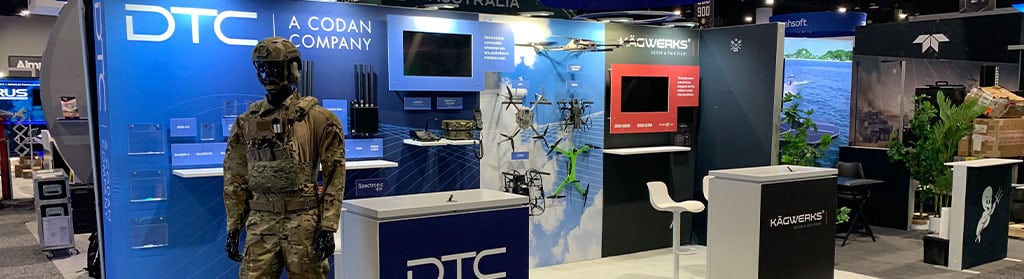 The Domo Tactical trade show booth displayed with the myWall+ system.